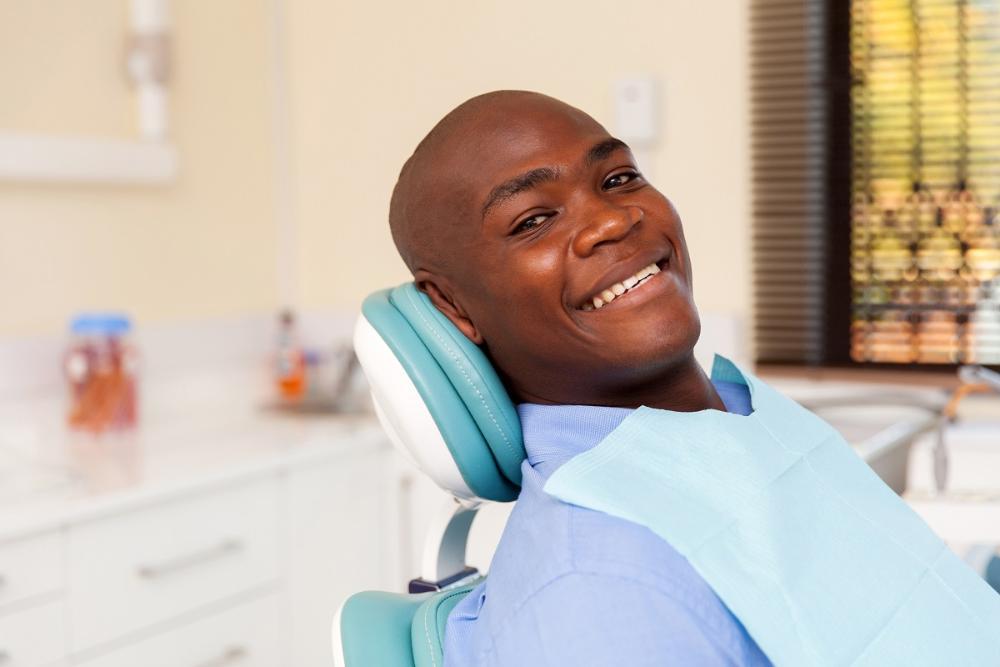 man smiling in dental chair